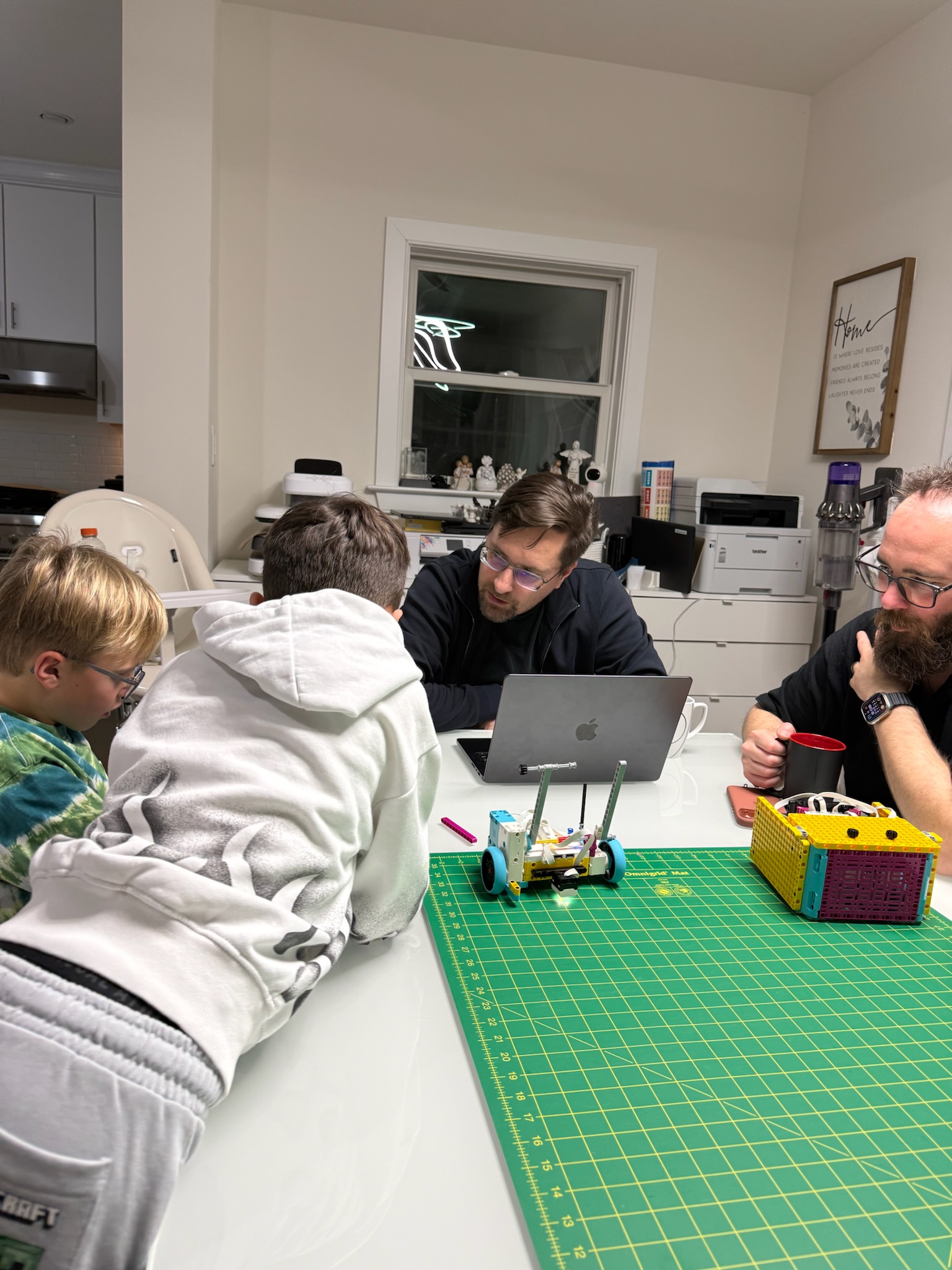 Tidal Engineers reviewing robot design with mentors